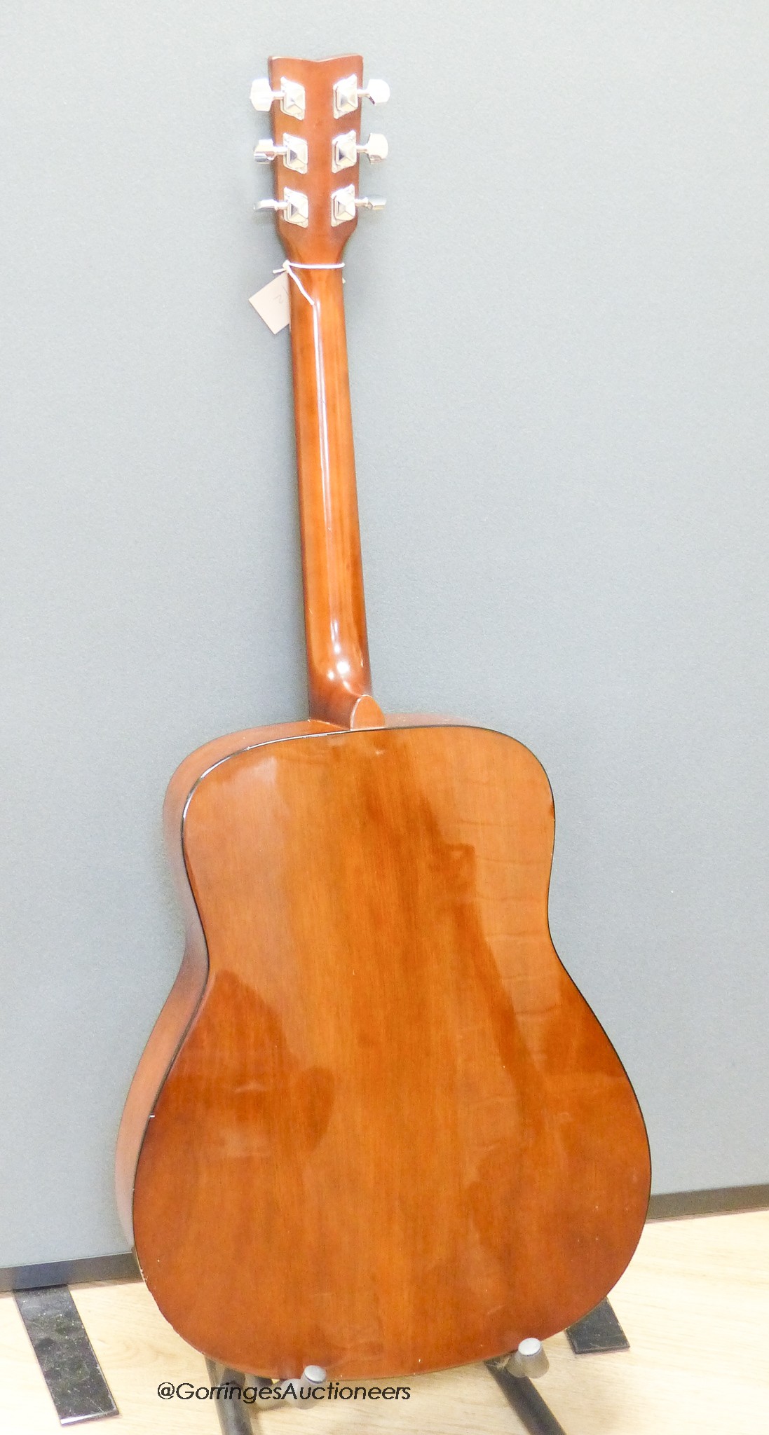 A Yamaha F310 acoustic guitar, carry case